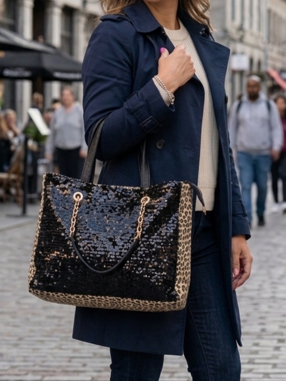 Black faux leather sequin bag with leopard print and chain handles
